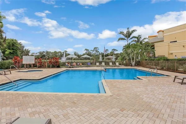 a front view of a house with a yard and a garage