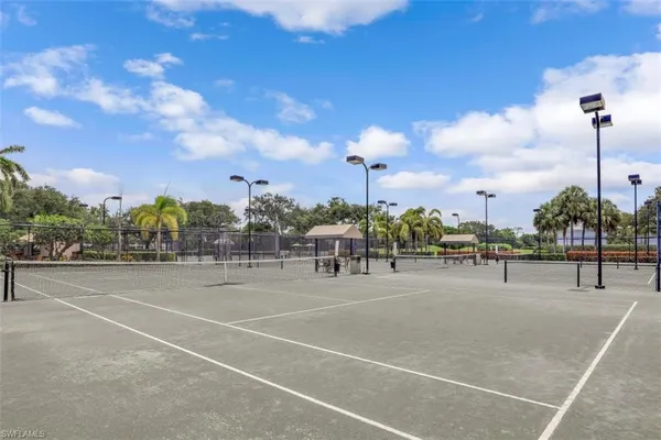 an aerial view of residential houses with outdoor space and ocean view