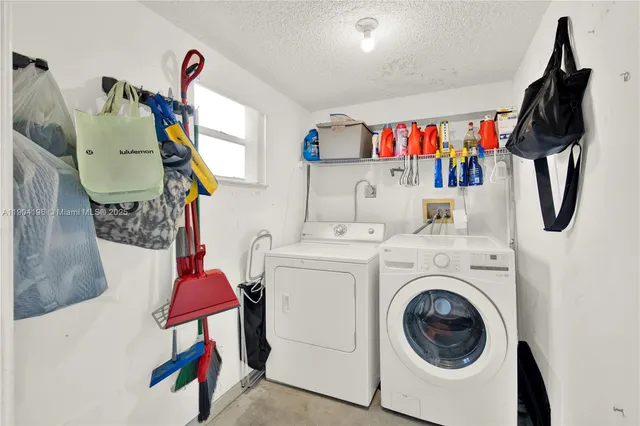 an aerial view of a house with a yard and lake view