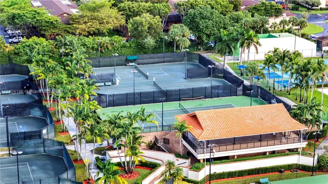 a aerial view of a house with a yard and lake view
