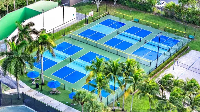 a multi story building view with swimming pool and garden