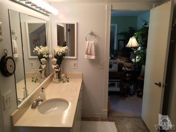 424 Reed Way Port Hueneme, CA 93041 - Photo 12 of 68 a bathroom with a sink and mirror