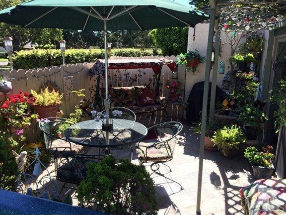 424 Reed Way Port Hueneme, CA 93041 - Photo 26 of 68 a view of a patio with table and chairs potted plants