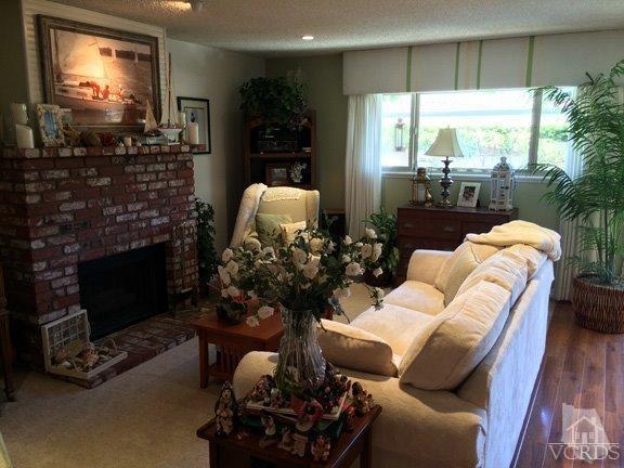 424 Reed Way Port Hueneme, CA 93041 - Photo 32 of 68 a living room with furniture a window and a fireplace