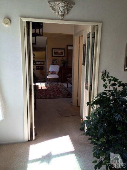 424 Reed Way Port Hueneme, CA 93041 - Photo 38 of 68 a hallway with white doors wooden floor and front door