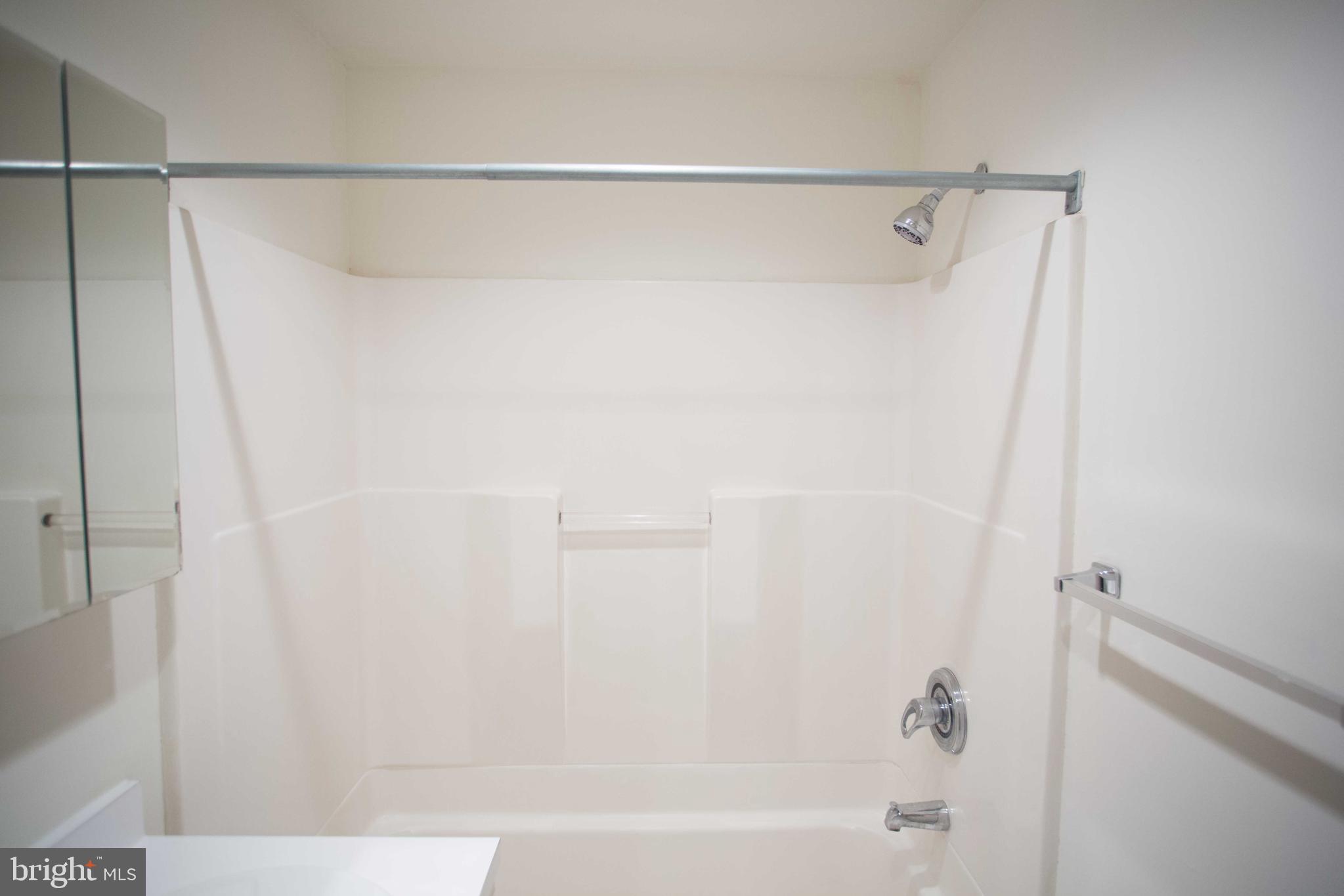 1411-3 Walnut Street, Unit 506 Philadelphia, PA 19102 - Photo 13 of 23 a bathroom with a shower and a bath tub