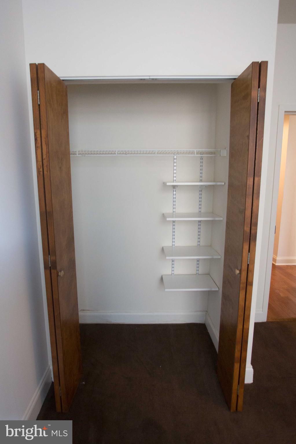 1411-3 Walnut Street, Unit 506 Philadelphia, PA 19102 - Photo 19 of 23 a view of walk in closet with empty racks
