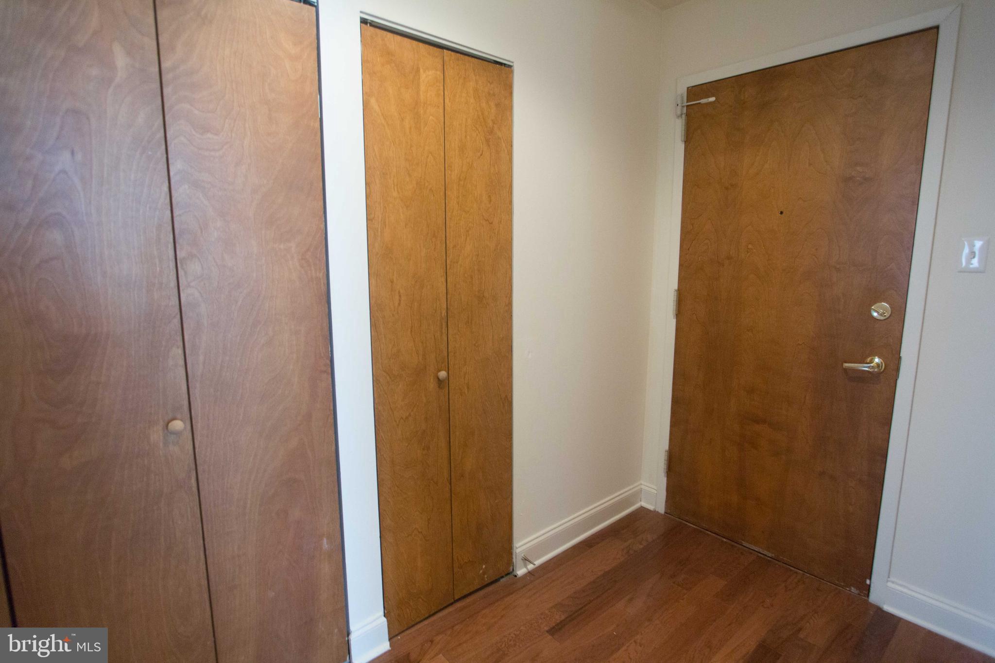 1411-3 Walnut Street, Unit 506 Philadelphia, PA 19102 - Photo 21 of 23 a view of an empty room with wooden floor
