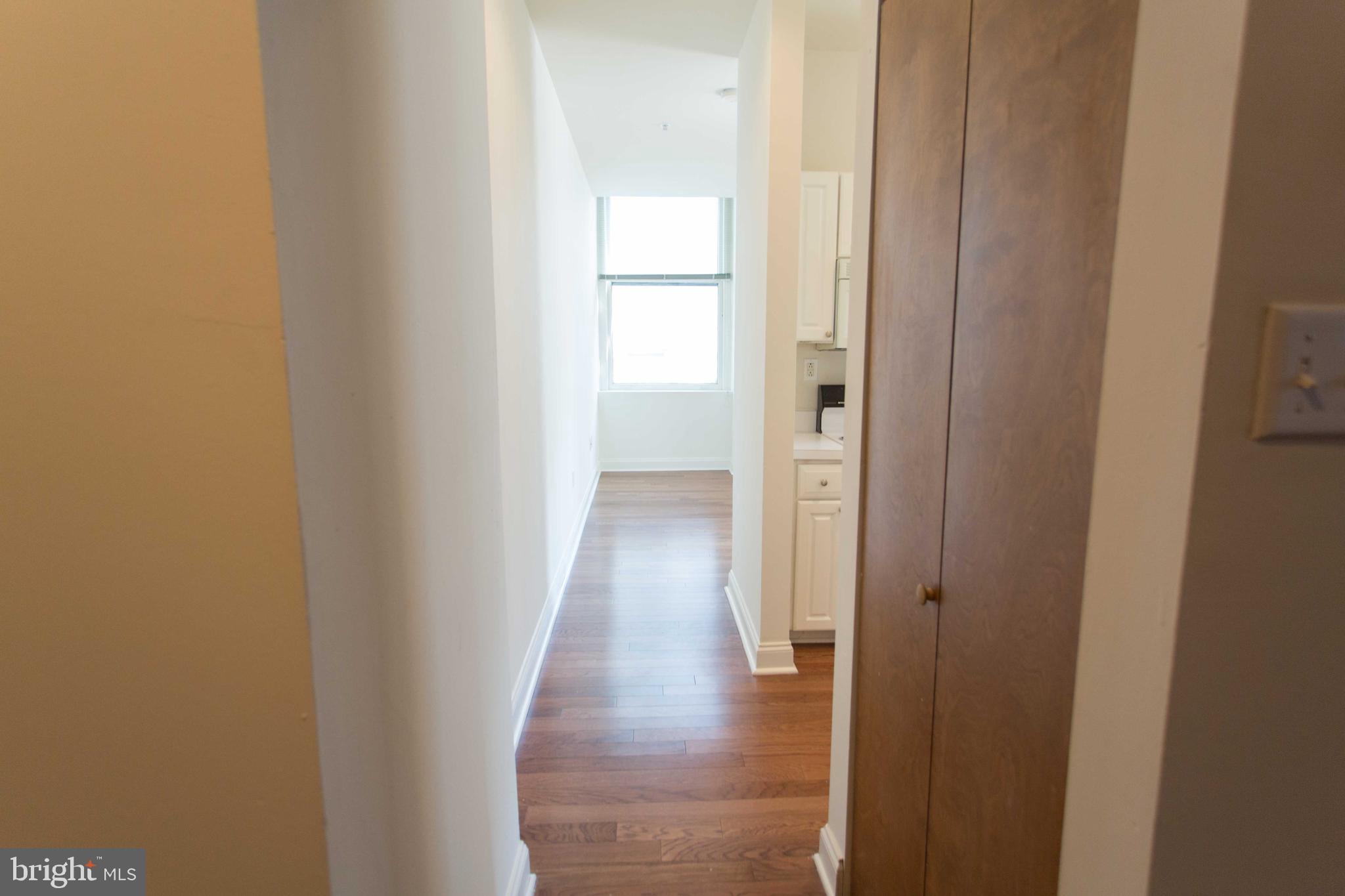 1411-3 Walnut Street, Unit 506 Philadelphia, PA 19102 - Photo 23 of 23 a view of a hallway with wooden floor