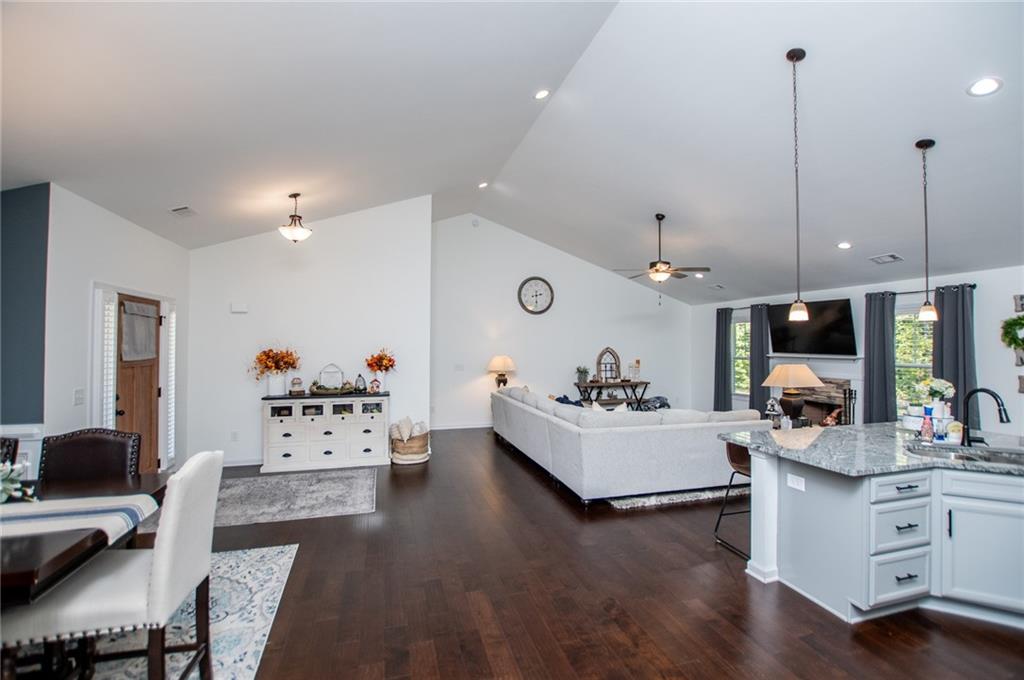 142 Lawrence Drive Villa Rica, GA 30180 - Photo 14 of 80 a living room with furniture or wooden floor and a chandelier