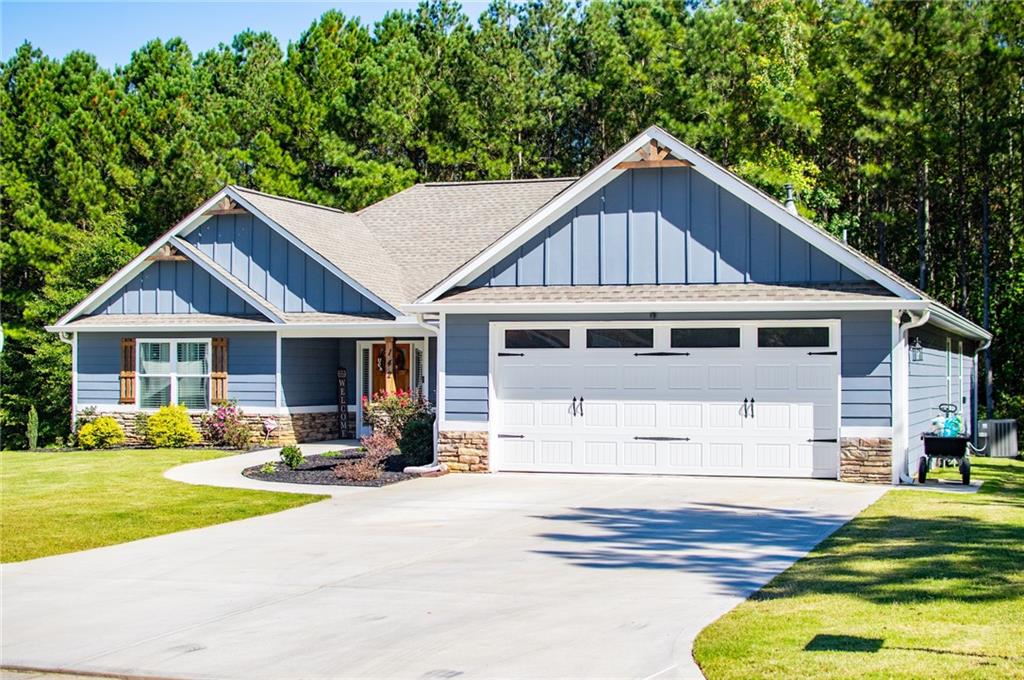 142 Lawrence Drive Villa Rica, GA 30180 - Photo 3 of 80 a front view of a house with yard and green space