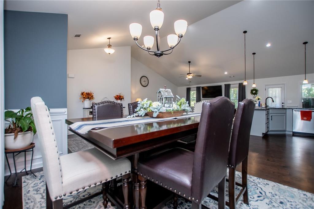 142 Lawrence Drive Villa Rica, GA 30180 - Photo 33 of 80 a view of a dining room with furniture and wooden floor