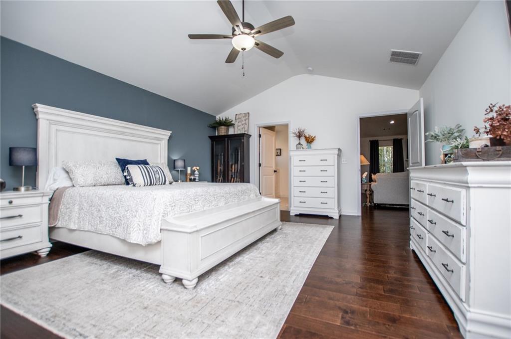 142 Lawrence Drive Villa Rica, GA 30180 - Photo 35 of 80 a bedroom with a large bed and dresser