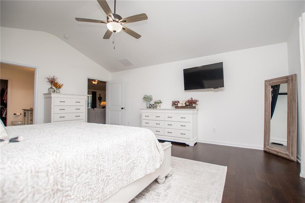 142 Lawrence Drive Villa Rica, GA 30180 - Photo 36 of 80 a bedroom with a bed and flat screen tv