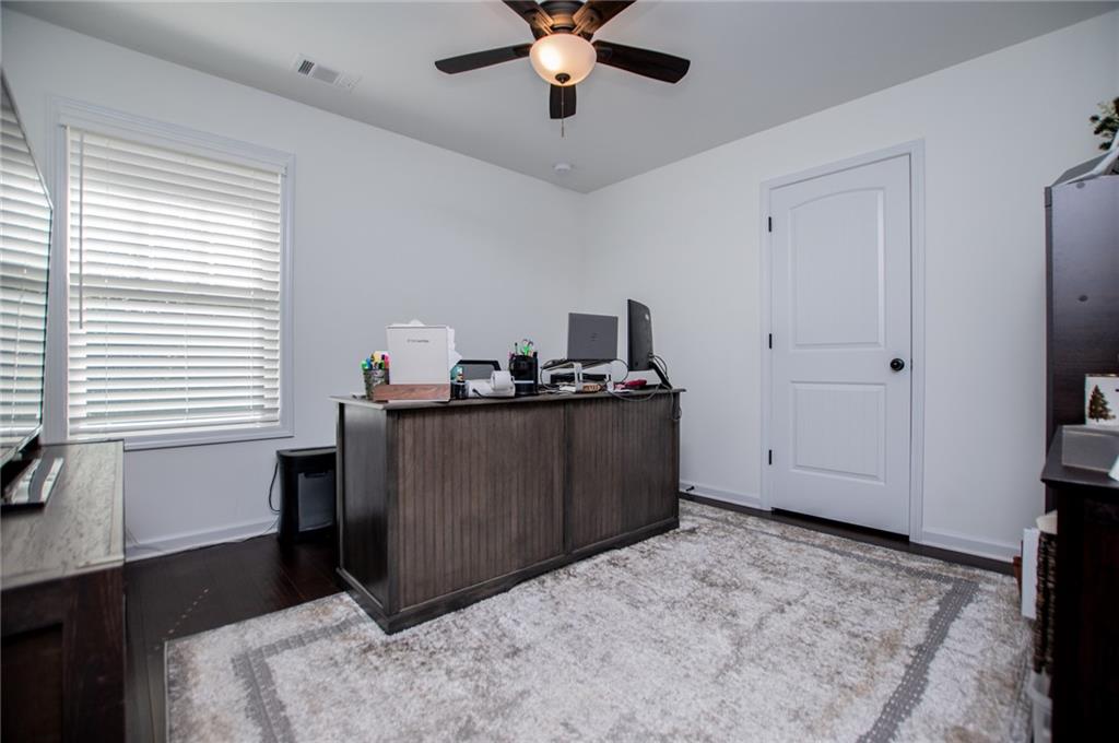 142 Lawrence Drive Villa Rica, GA 30180 - Photo 60 of 80 a bedroom with a bed and a window