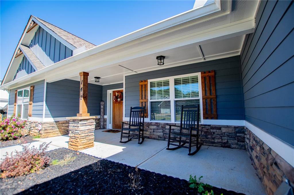 142 Lawrence Drive Villa Rica, GA 30180 - Photo 6 of 80 a front view of a house with outdoor seating