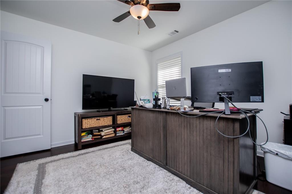 142 Lawrence Drive Villa Rica, GA 30180 - Photo 61 of 80 a living room with furniture and a flat screen tv