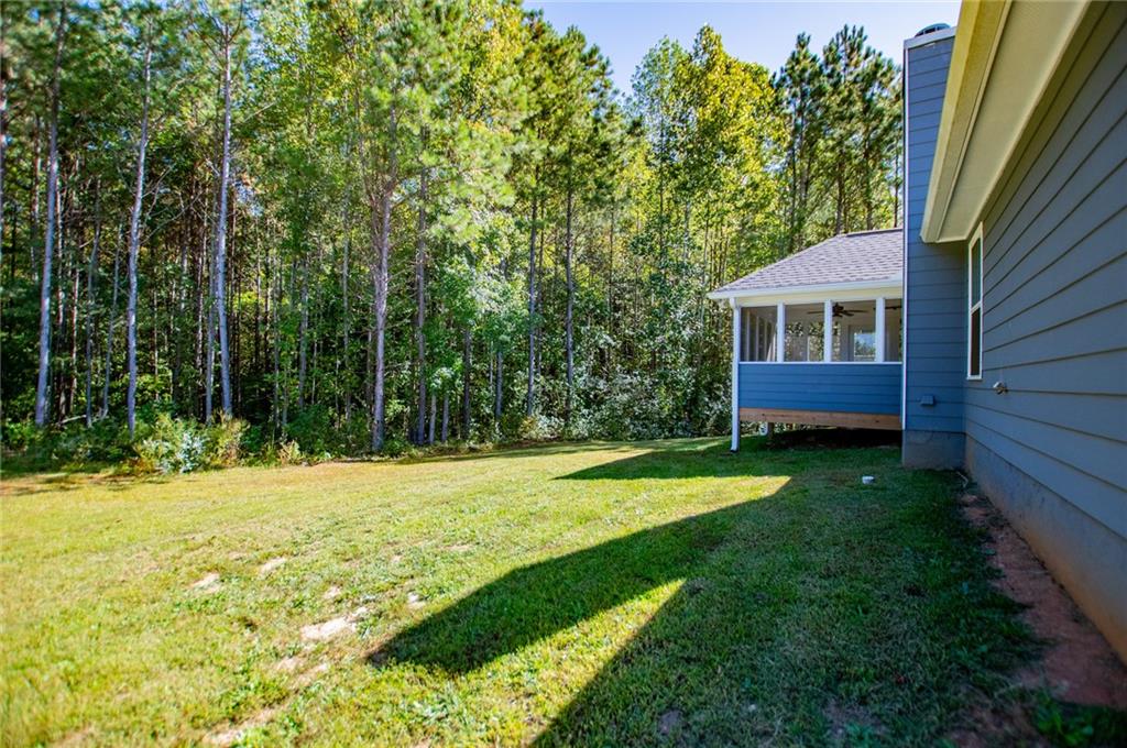 142 Lawrence Drive Villa Rica, GA 30180 - Photo 68 of 80 a view of a backyard with a garden