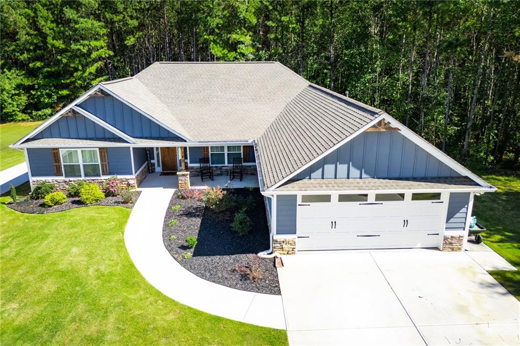 142 Lawrence Drive Villa Rica, GA 30180 - Photo 75 of 80 a view of a big house with wooden fence