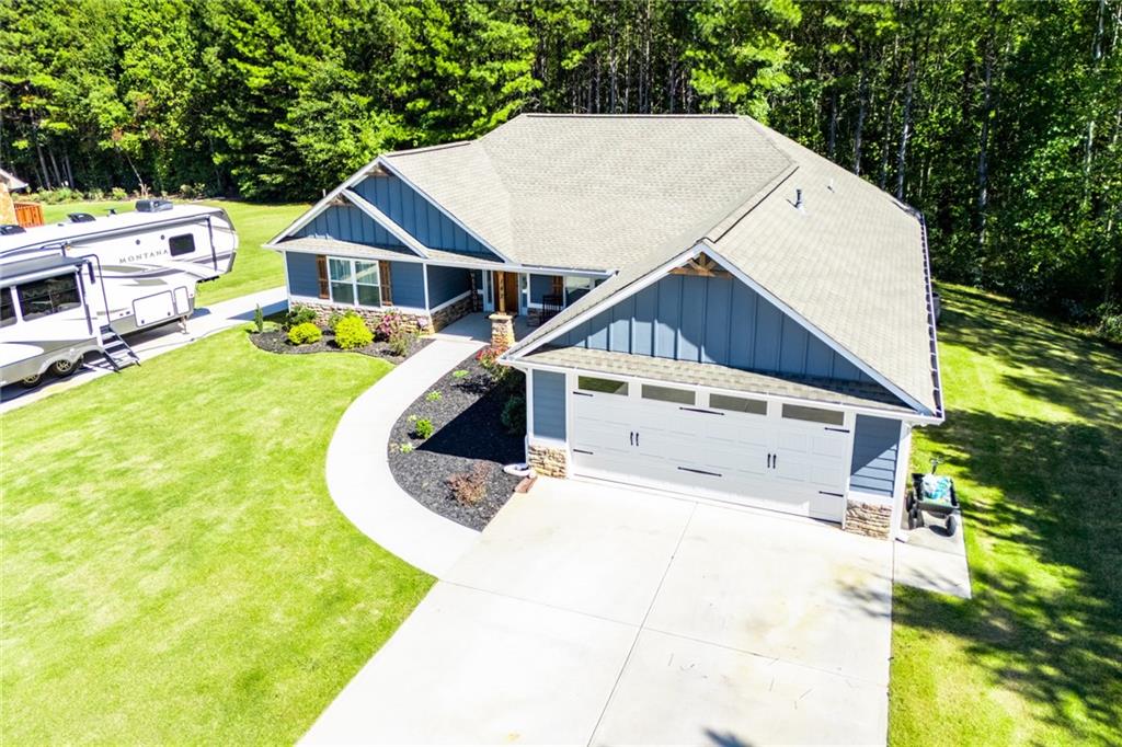 142 Lawrence Drive Villa Rica, GA 30180 - Photo 80 of 80 a aerial view of a house with a yard and sitting area