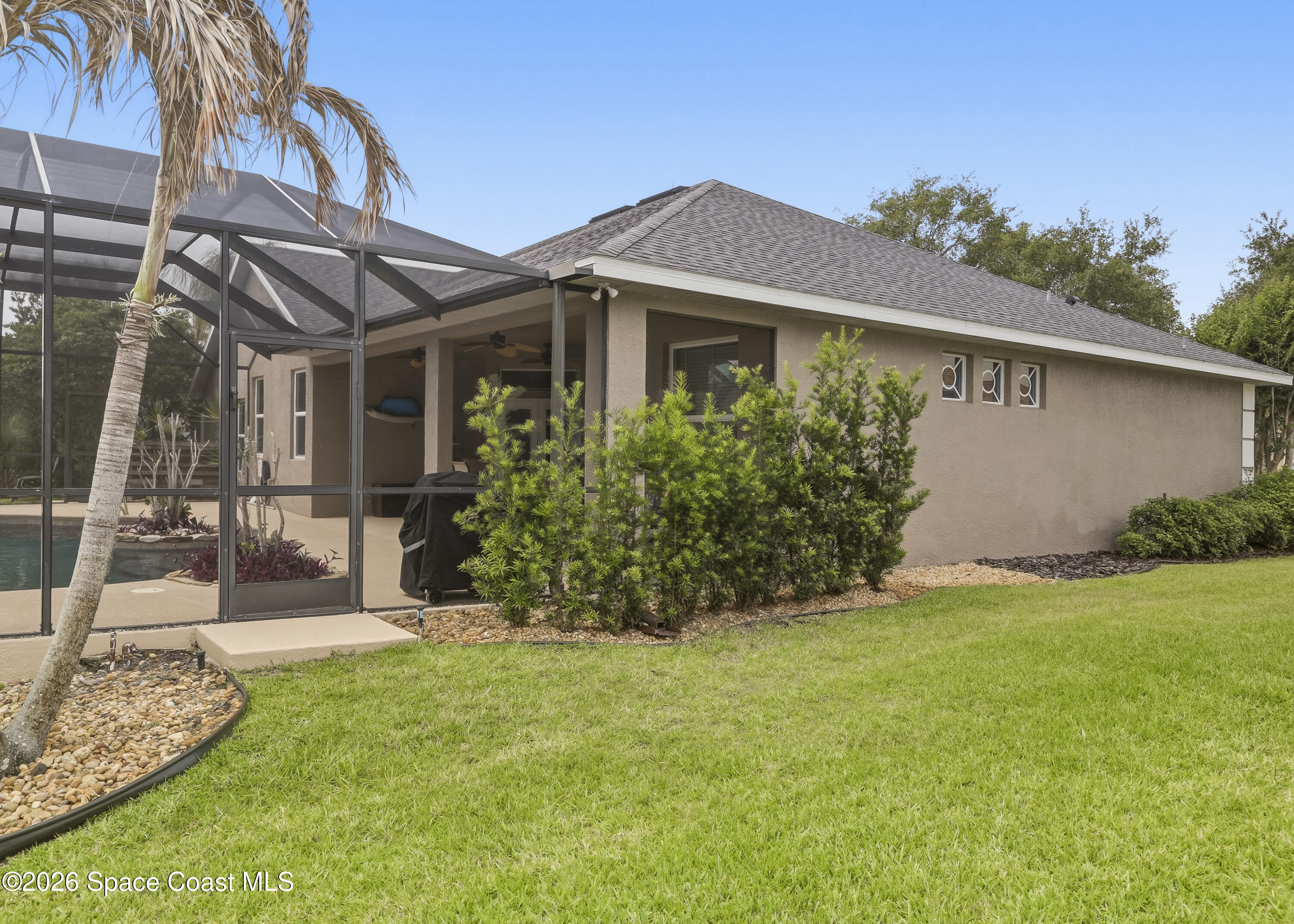 1643 Long Pine Road Melbourne, FL 32940 - Photo 57 of 63 a front view of a house with garden