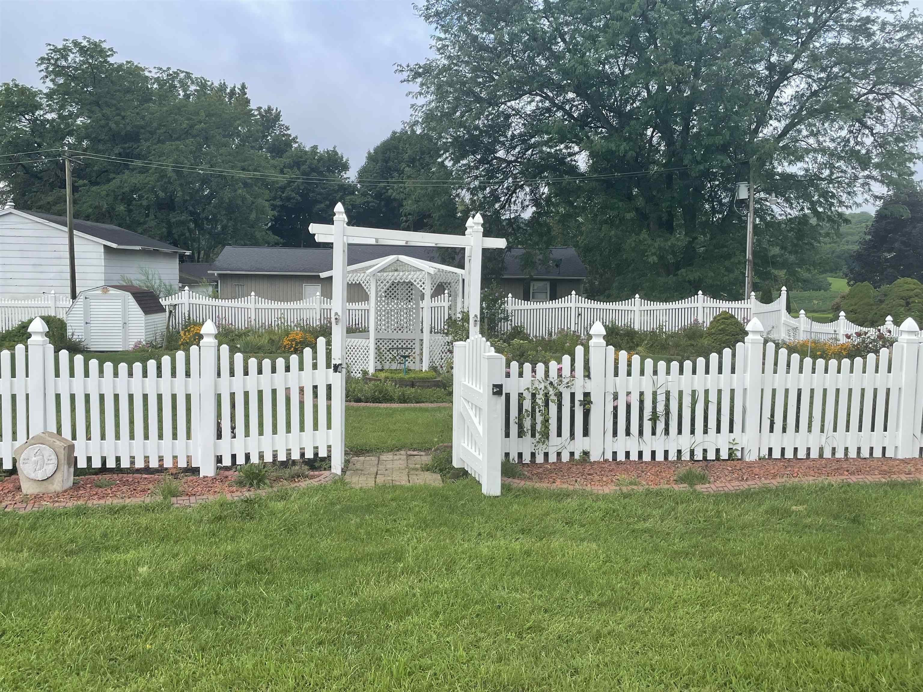 109 Division Street Hanover, IL 61041 - Photo 3 of 28 a view of a deck with a fence