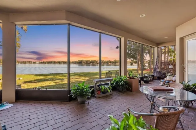 a living room filled with furniture and a large window
