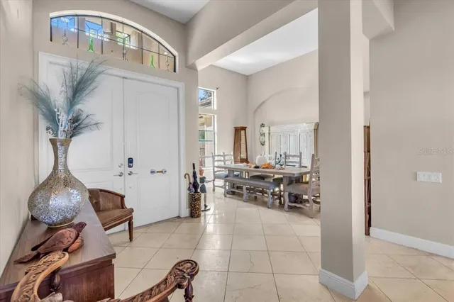 a dining room with furniture and wooden floor
