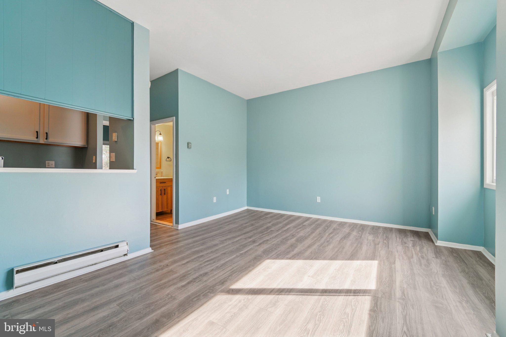 9432 Merryrest Road, Unit AB Columbia, MD 21045 - Photo 11 of 37 a view of a room with wooden floor