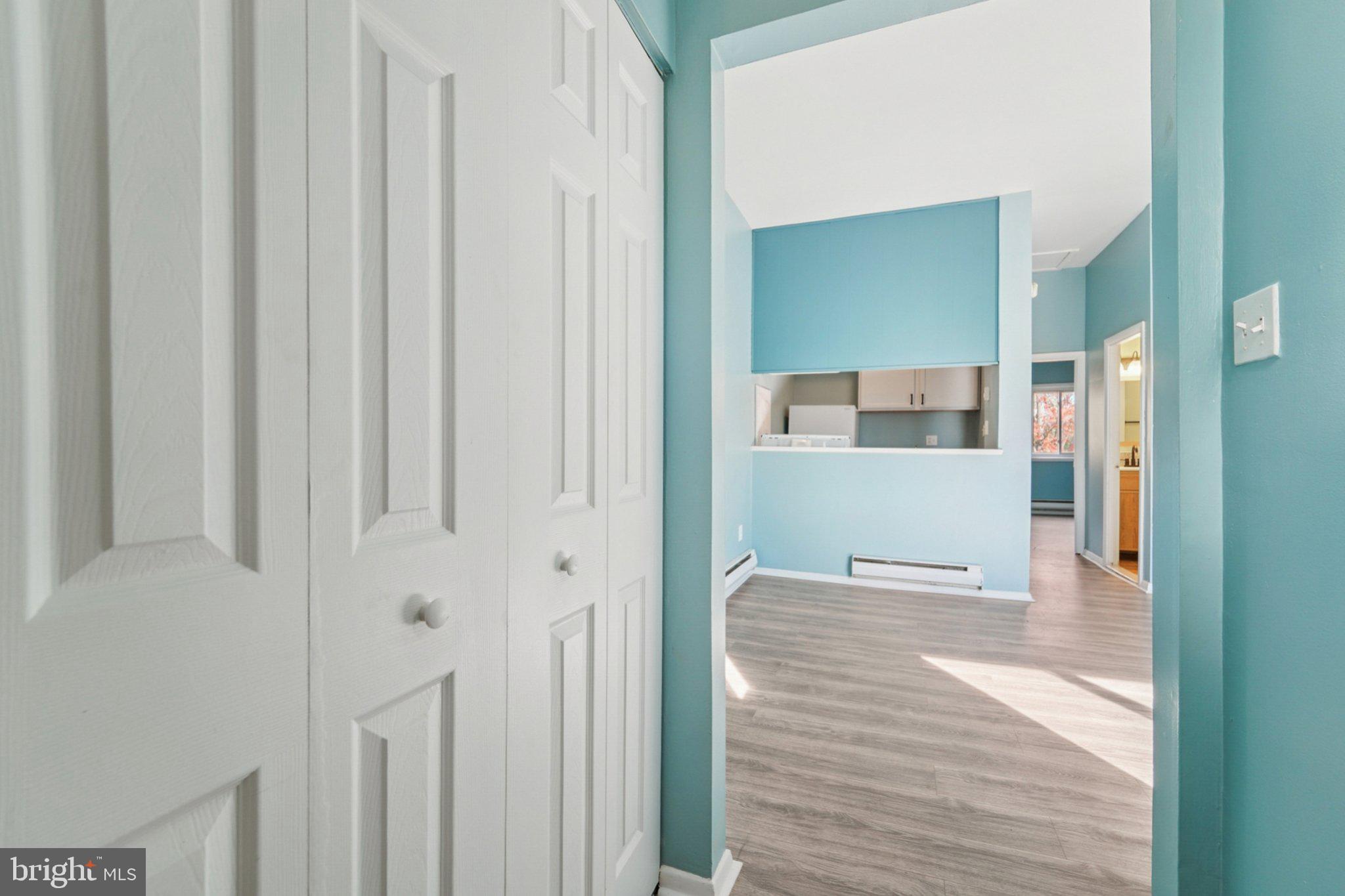 9432 Merryrest Road, Unit AB Columbia, MD 21045 - Photo 14 of 37 a view of a hallway with wooden floor