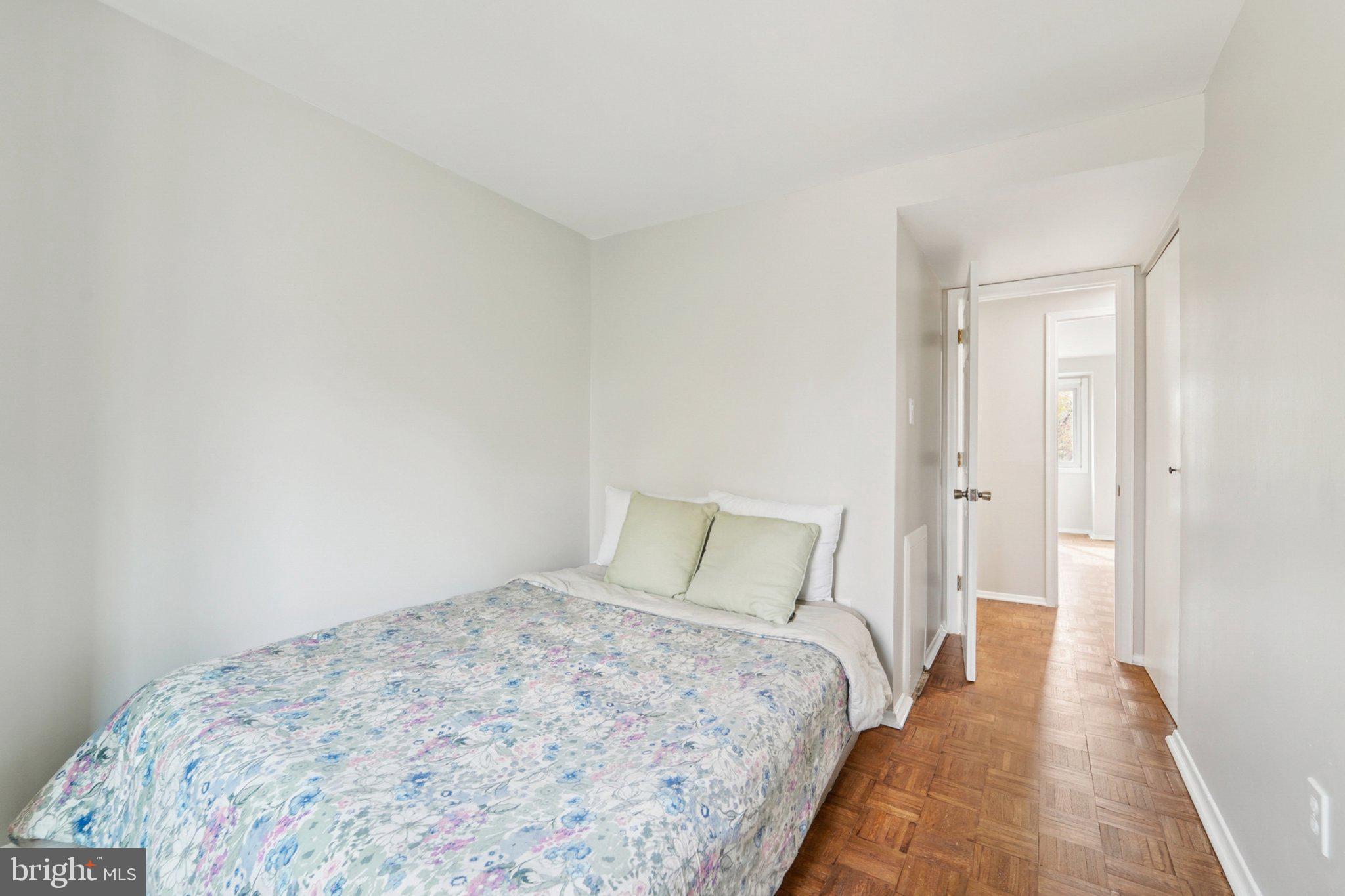 9432 Merryrest Road, Unit AB Columbia, MD 21045 - Photo 20 of 37 a bedroom with a bed and a painting on the wall