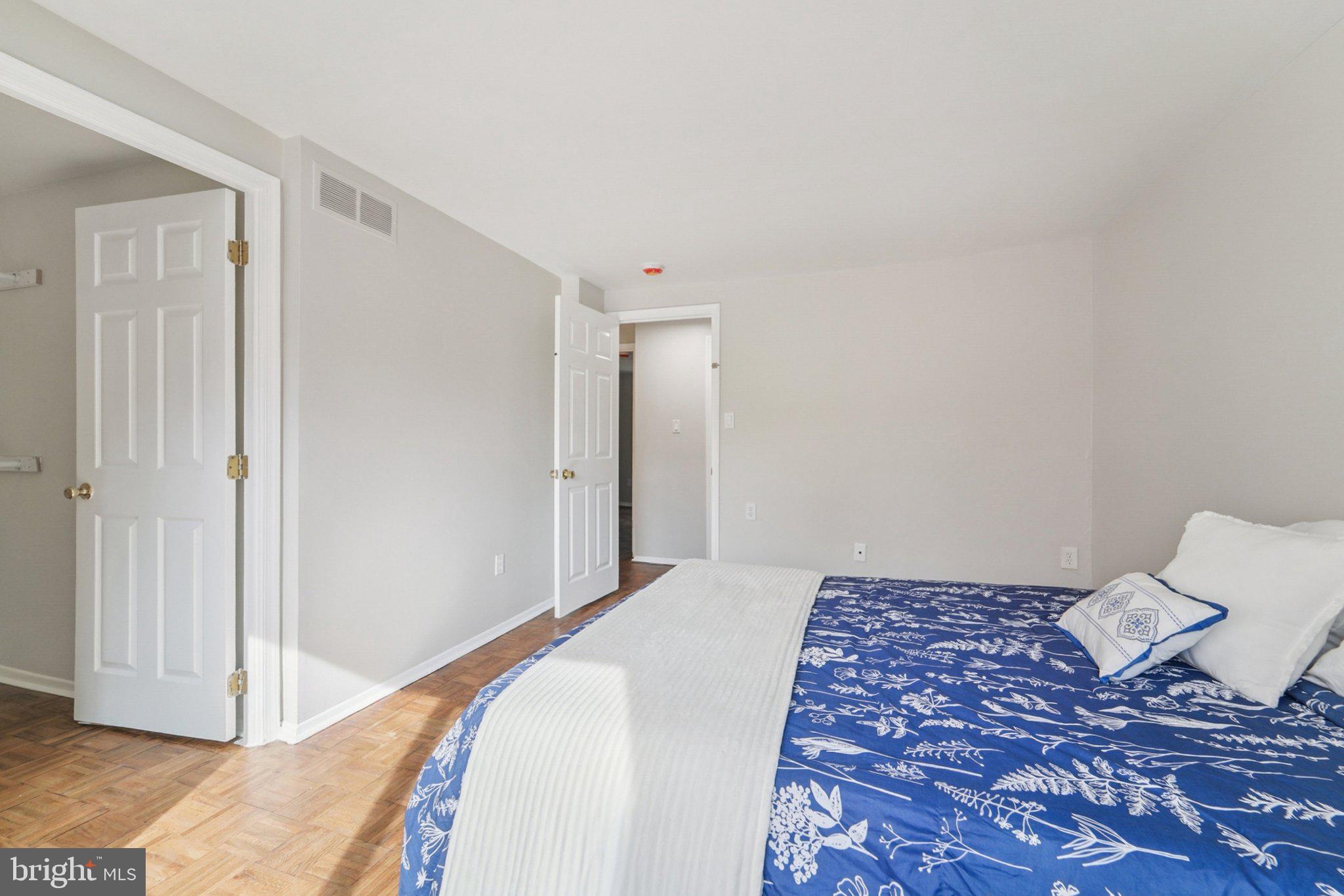 9432 Merryrest Road, Unit AB Columbia, MD 21045 - Photo 23 of 37 a view of a bedroom with wooden floor and bedroom
