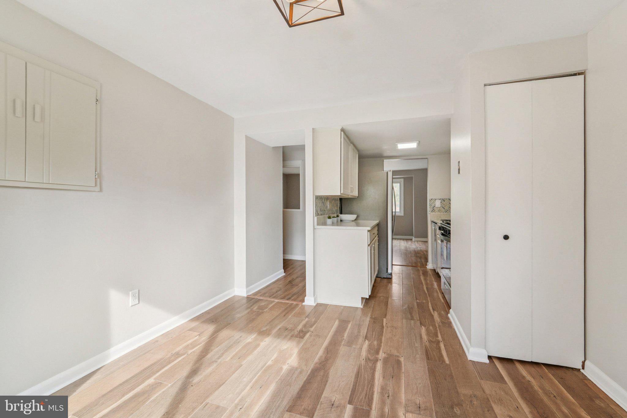 9432 Merryrest Road, Unit AB Columbia, MD 21045 - Photo 28 of 37 a view of a kitchen with wooden floor