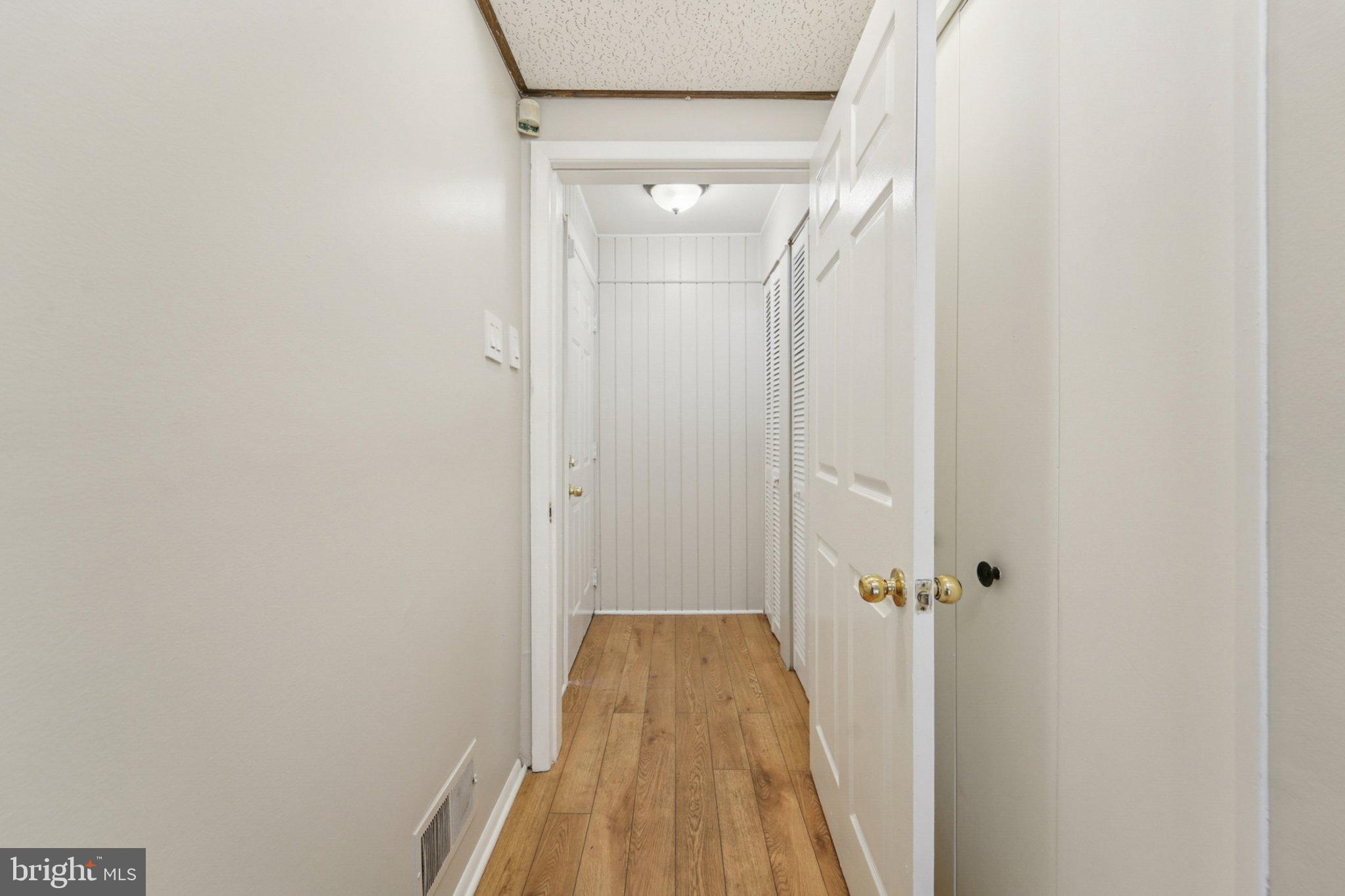 9432 Merryrest Road, Unit AB Columbia, MD 21045 - Photo 30 of 37 a view of a bathroom with wooden floor