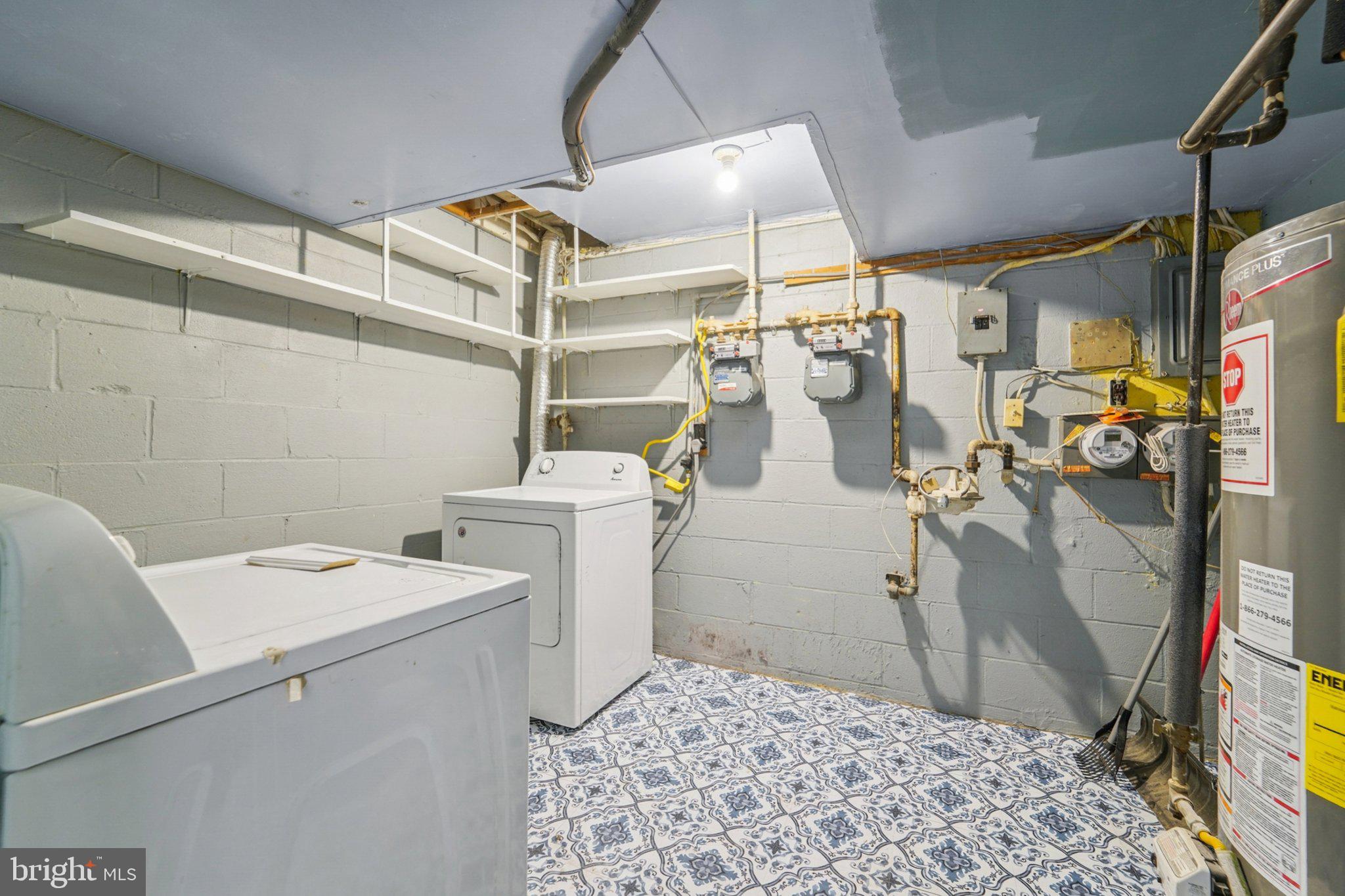 9432 Merryrest Road, Unit AB Columbia, MD 21045 - Photo 35 of 37 a utility room with dryer and washer
