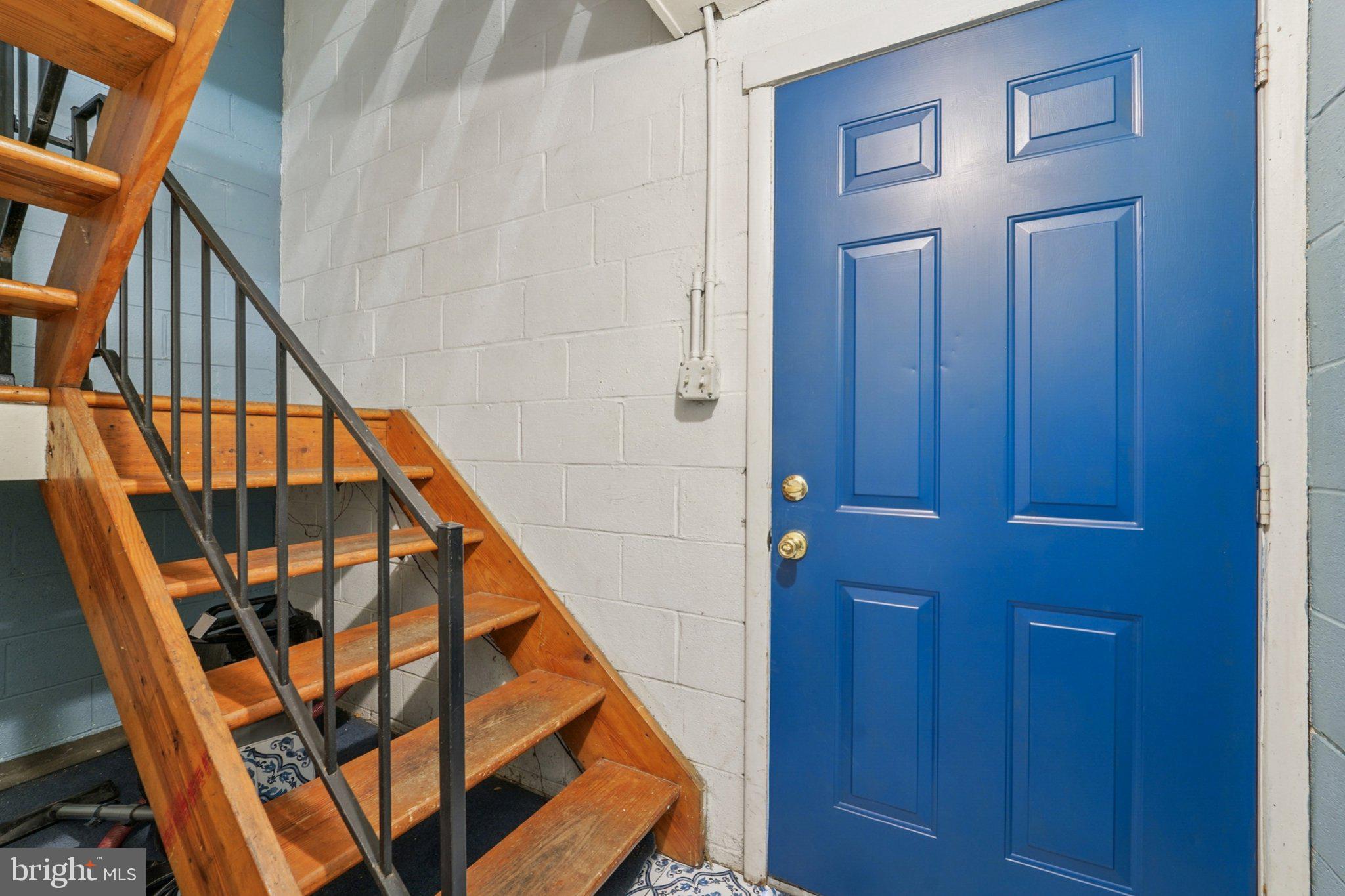 9432 Merryrest Road, Unit AB Columbia, MD 21045 - Photo 6 of 37 a way to bed room with wooden floor and stairs
