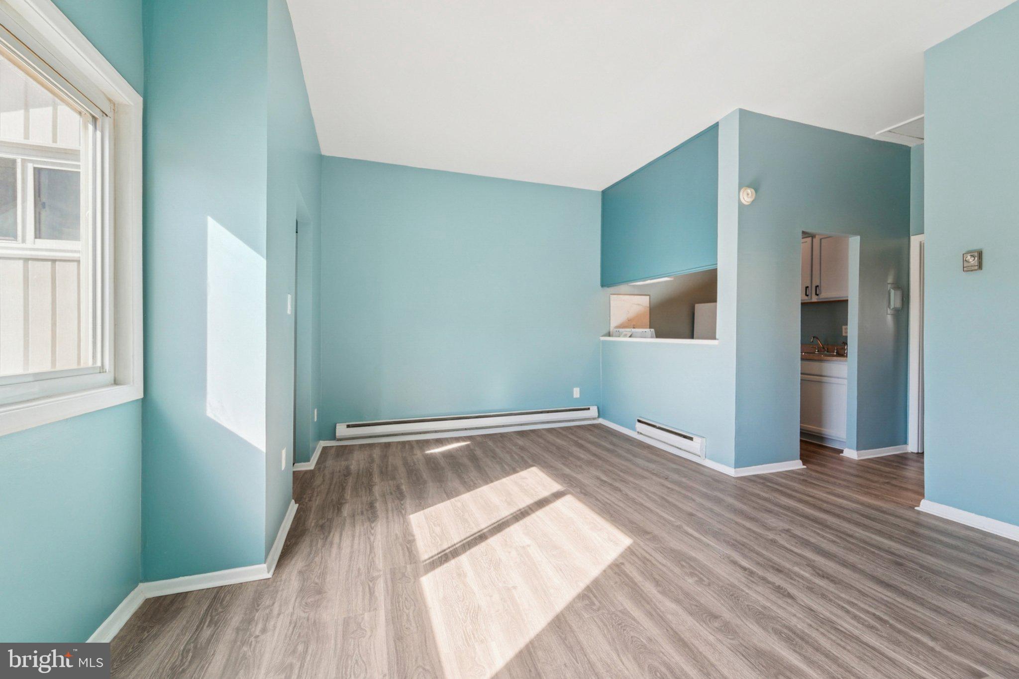 9432 Merryrest Road, Unit AB Columbia, MD 21045 - Photo 10 of 37 a view of empty room with wooden floor
