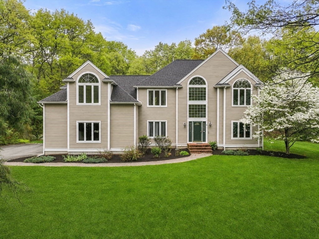 11 Black Elk Road Sharon, MA 02067 - Photo 1 of 28 a front view of a house with a garden