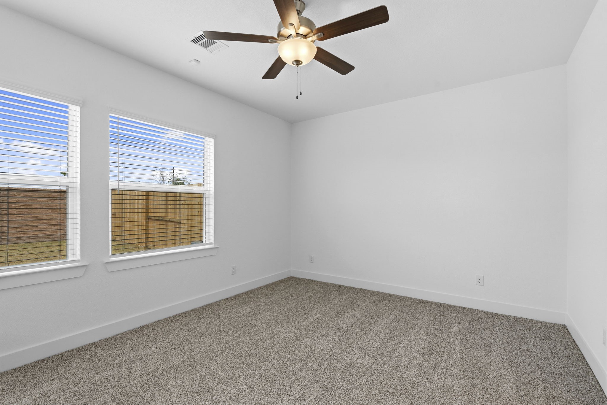 5251 Celestial Court Rosharon, TX 77583 - Photo 22 of 46 an empty room with a window and a fan