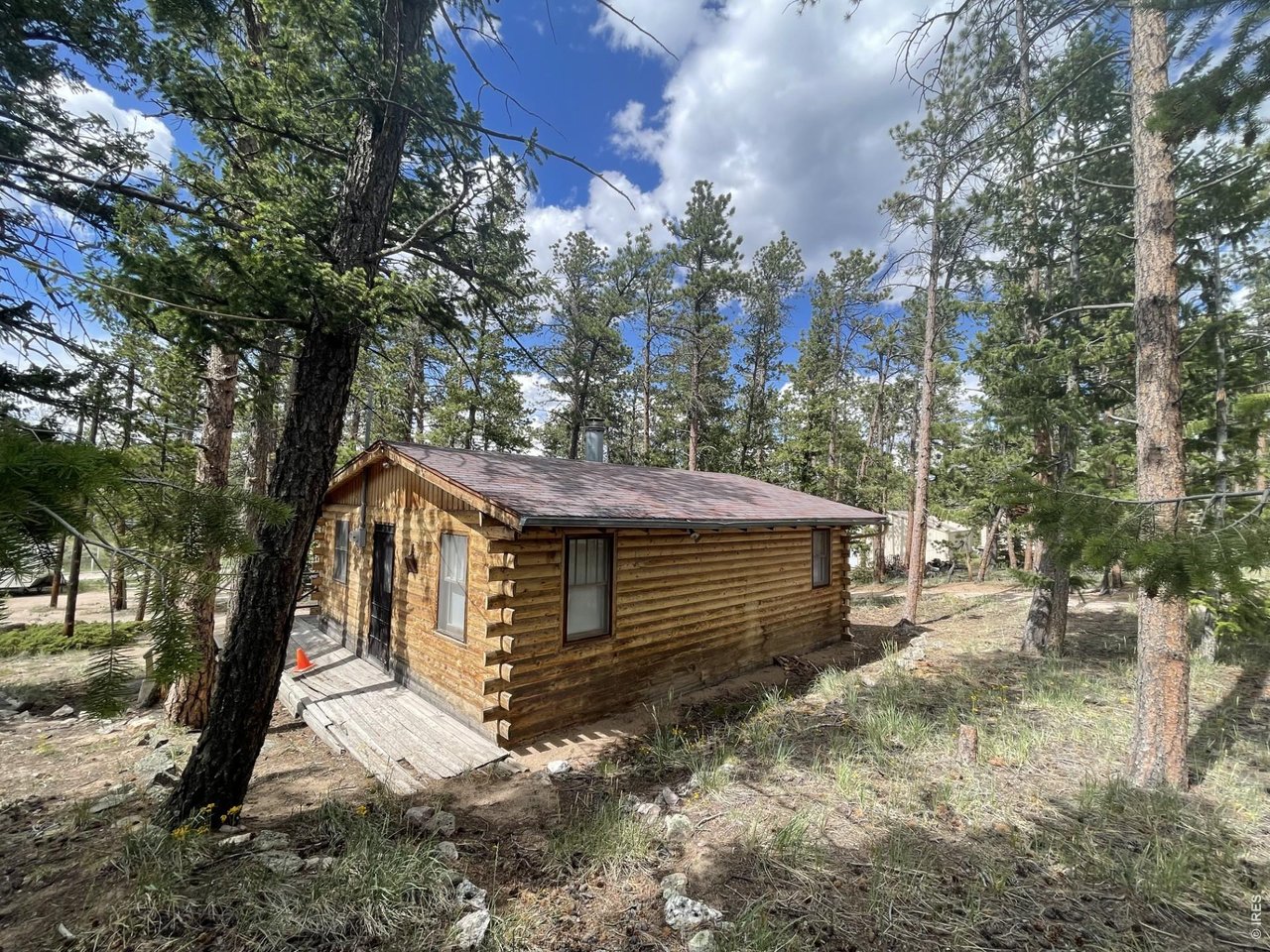 35 Robin Path Red Feather Lakes, CO 80545 - Photo 5 of 25 Looking at the cabin from the privy area.