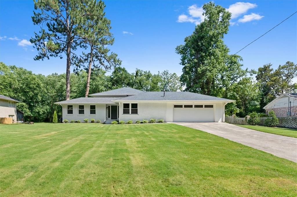 2376 Spring Creek Road Decatur, GA 30033 - Photo 1 of 1 a front view of a house with a garden