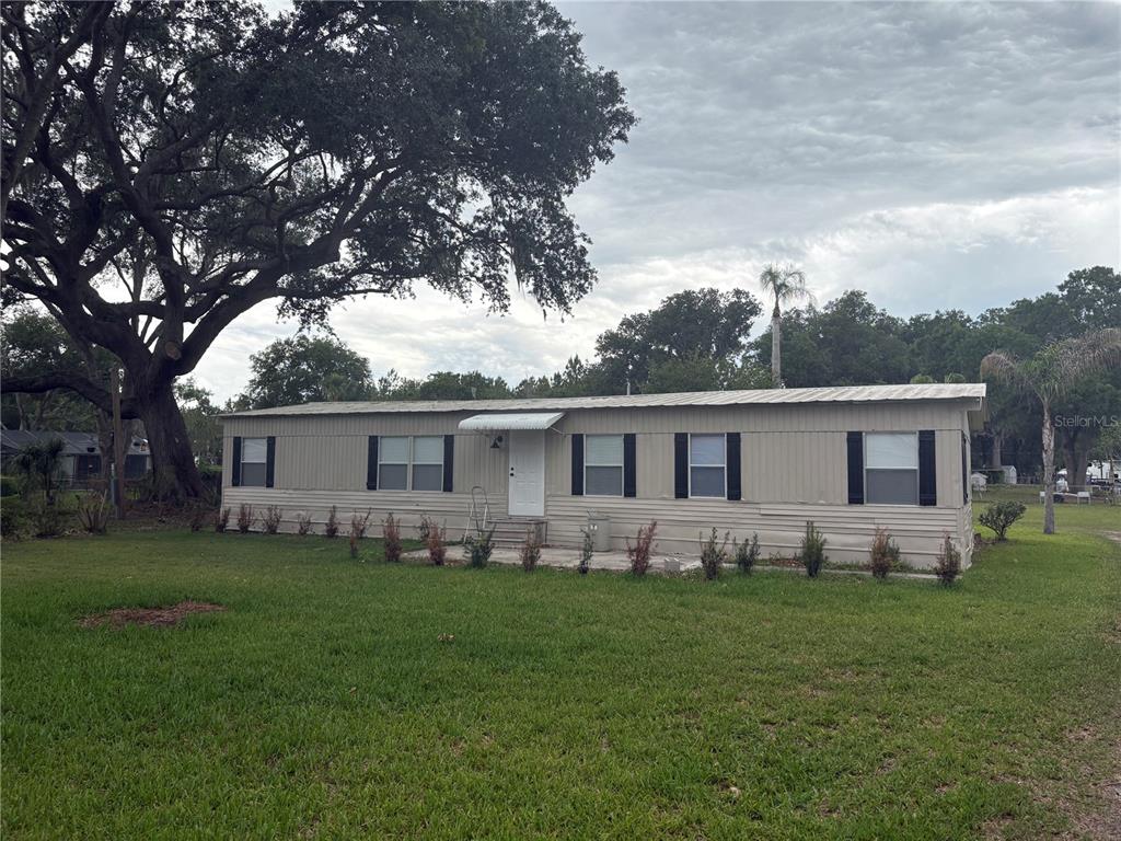 3923 Ward Road Lakeland, FL 33810 - Photo 1 of 25 a front view of house with yard and green space
