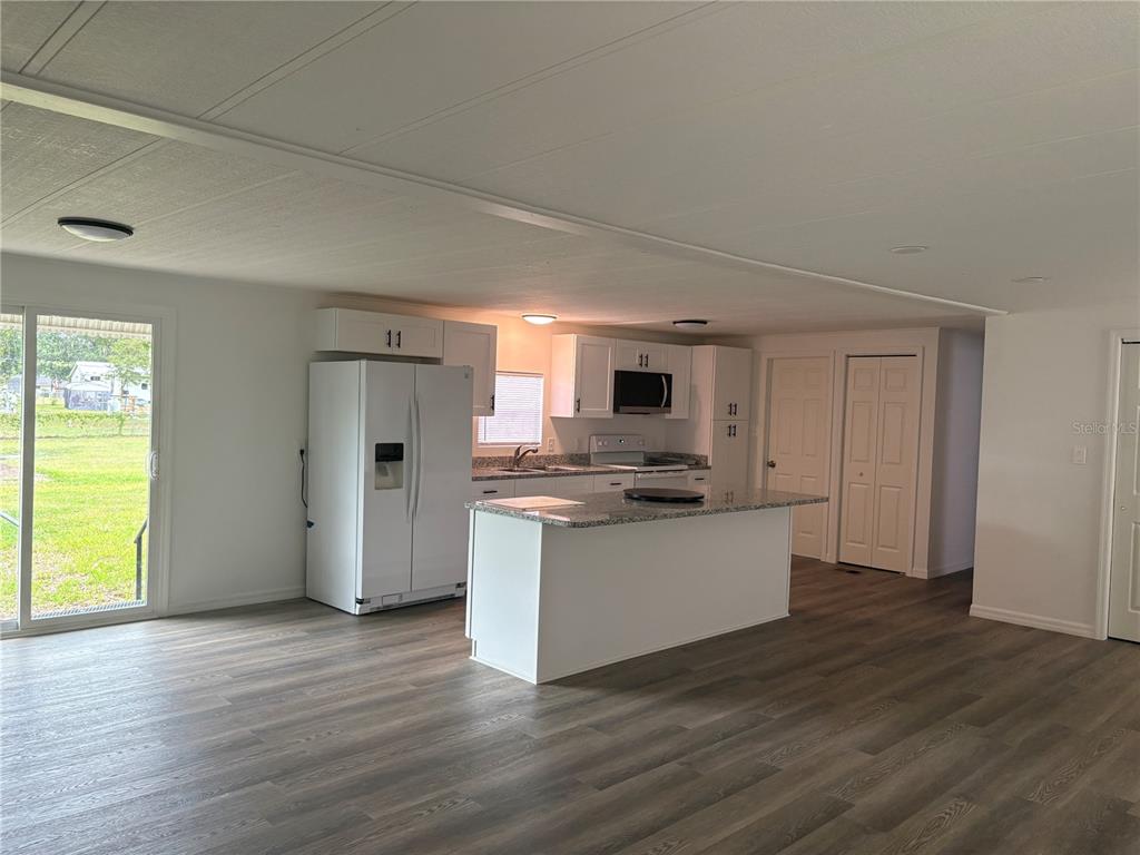 3923 Ward Road Lakeland, FL 33810 - Photo 16 of 25 a kitchen with stainless steel appliances a refrigerator and a stove top oven