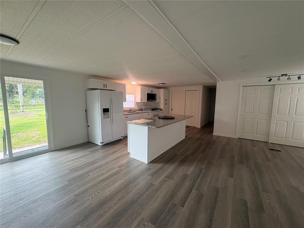 3923 Ward Road Lakeland, FL 33810 - Photo 9 of 25 a view of a kitchen with wooden floor and a sink