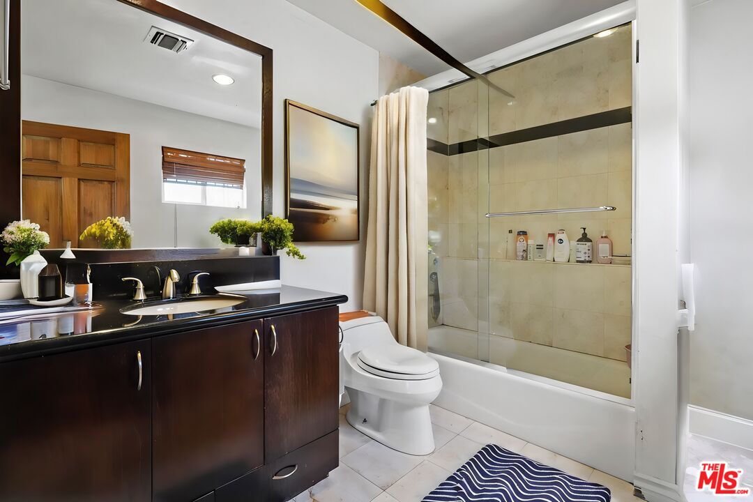 2477 Coolidge Avenue Los Angeles, CA 90064 - Photo 10 of 30 a bathroom with a sink a toilet and shower