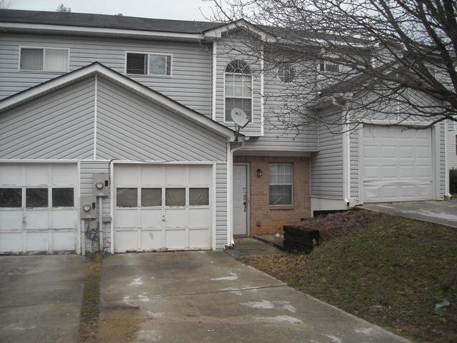 3786 Soapstone Road Decatur, GA 30034 - Photo 1 of 1 a view of a house with a yard and garage
