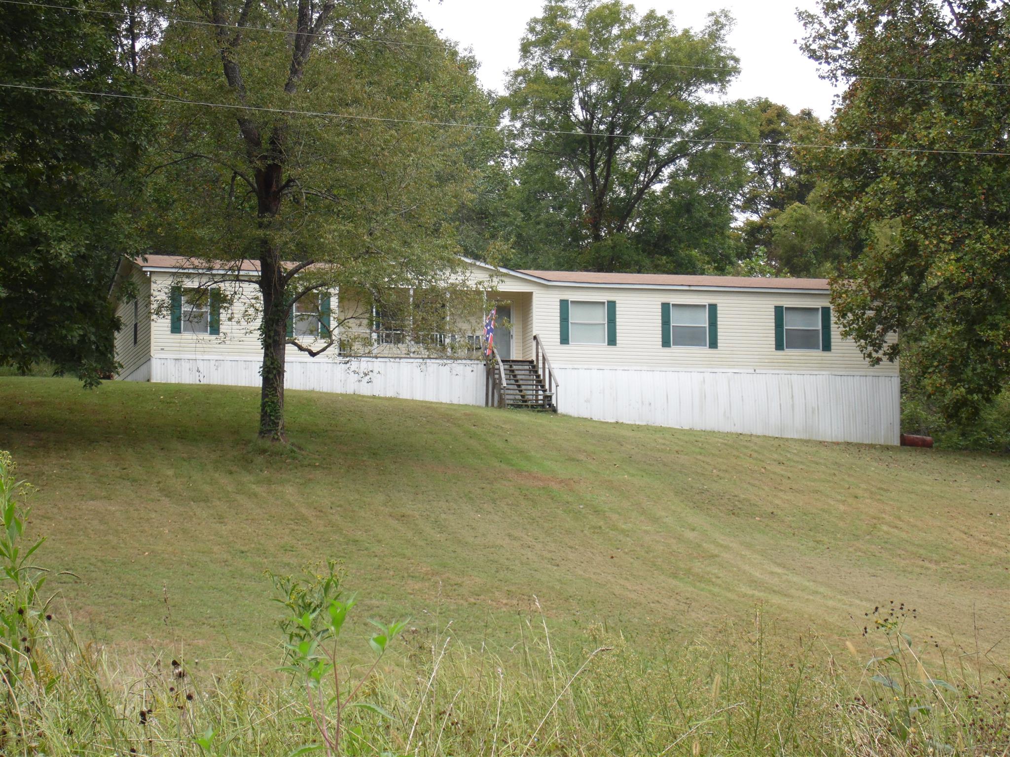 6531 Porters Branch Road Santa Fe, TN 38482 - Photo 1 of 18 a view of a house with backyard and trees