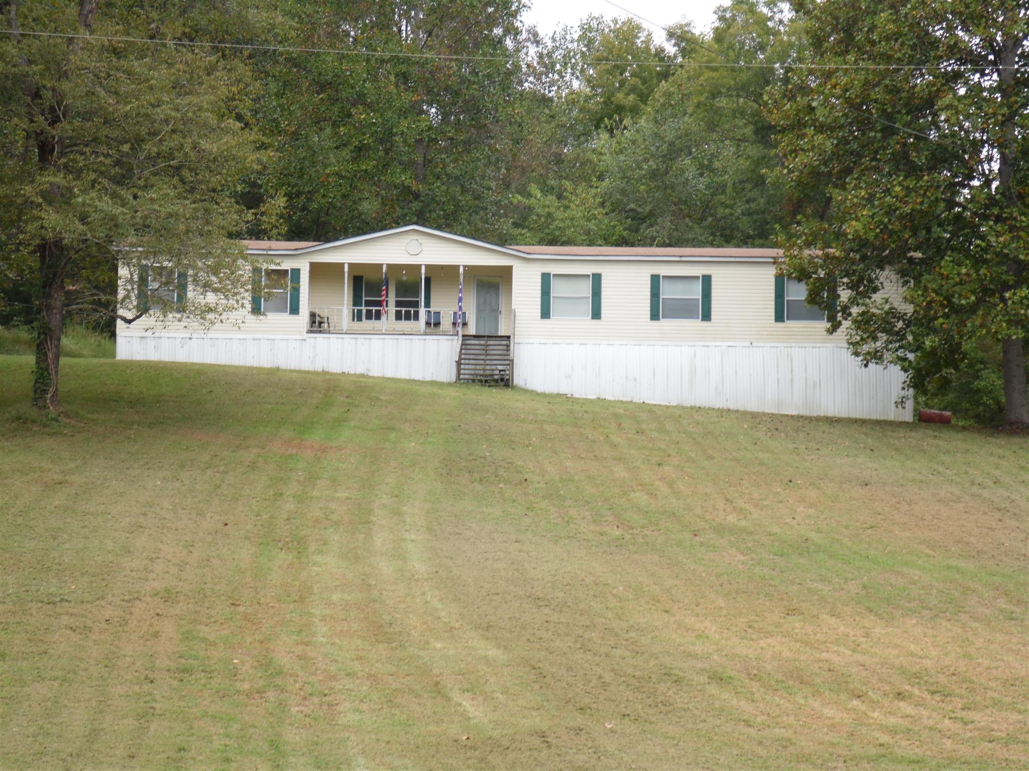 6531 Porters Branch Road Santa Fe, TN 38482 - Photo 2 of 18 a front view of a house with a garden