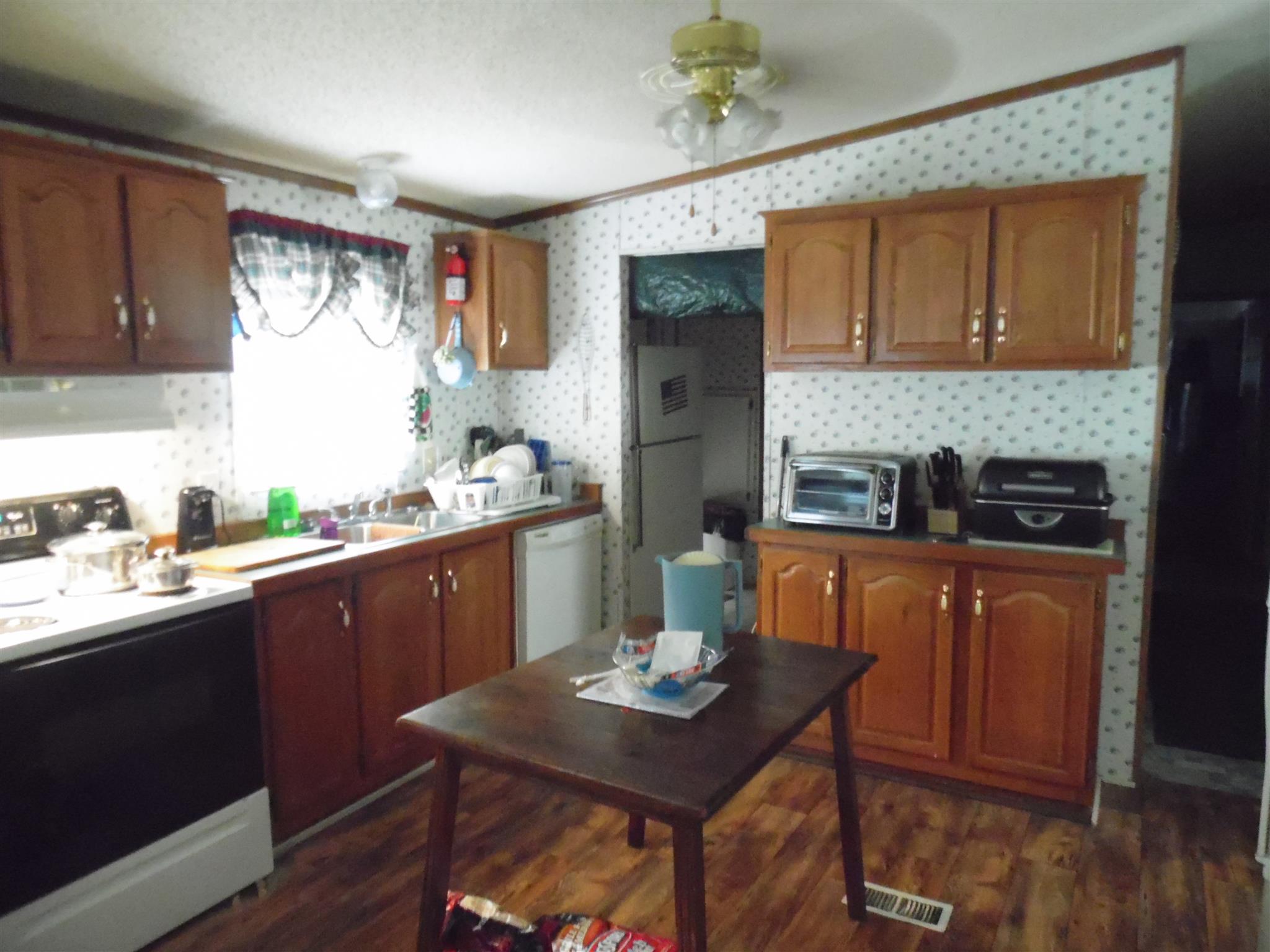 6531 Porters Branch Road Santa Fe, TN 38482 - Photo 9 of 18 a kitchen with a table and chairs in it