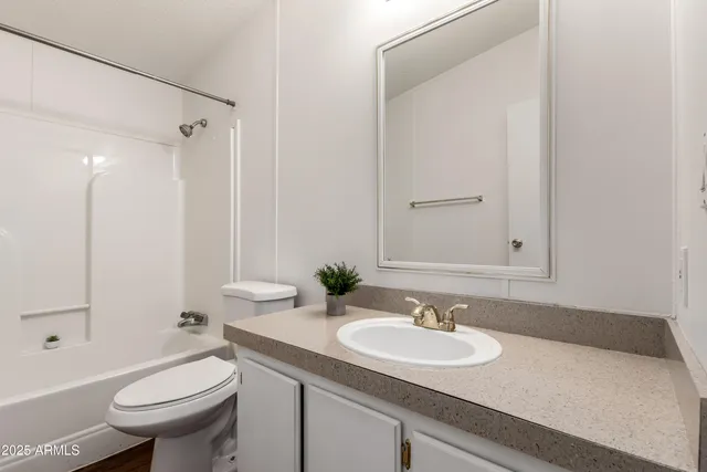 a bathroom with a sink and toilet